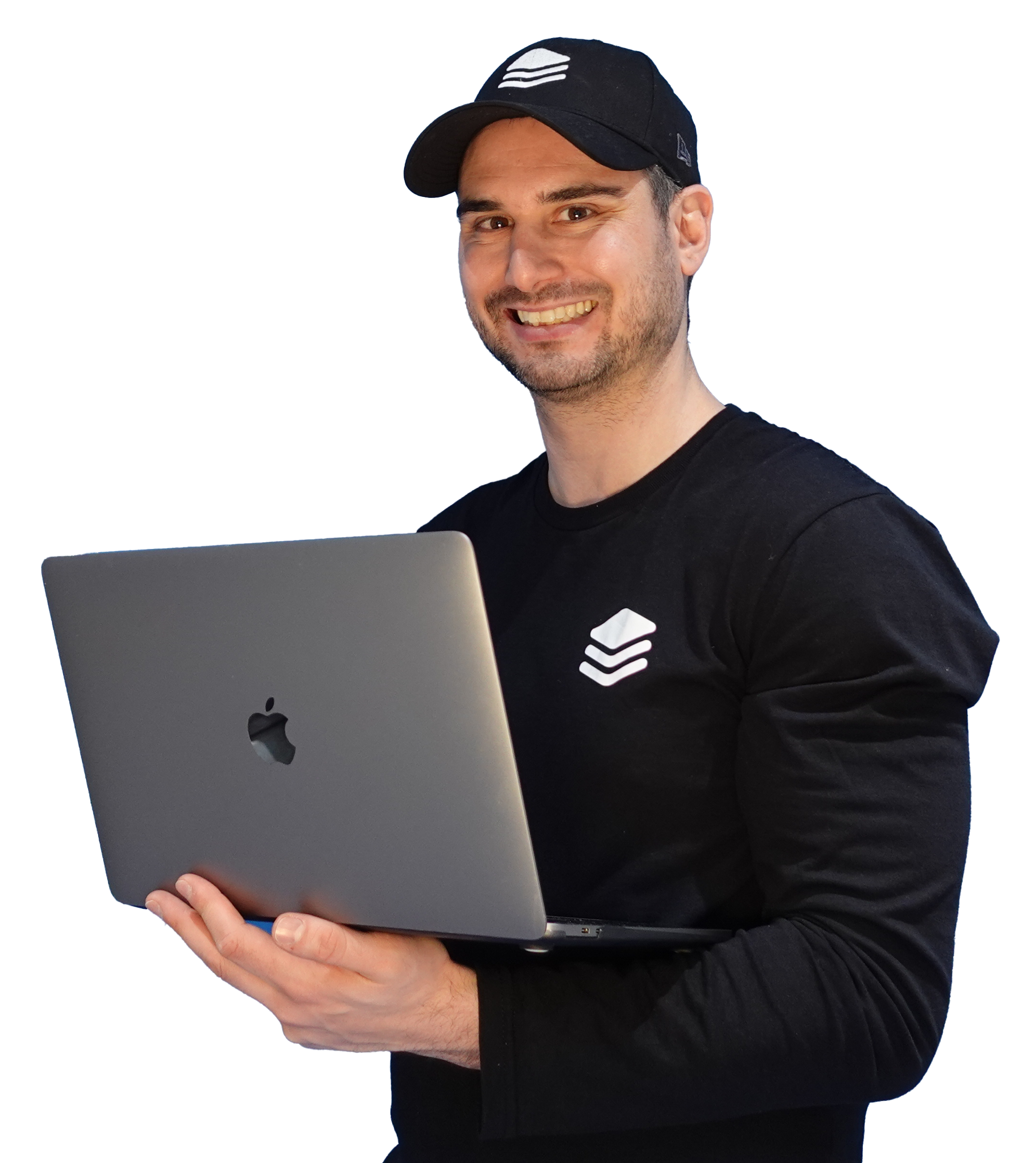 Person holding laptop and smiling.